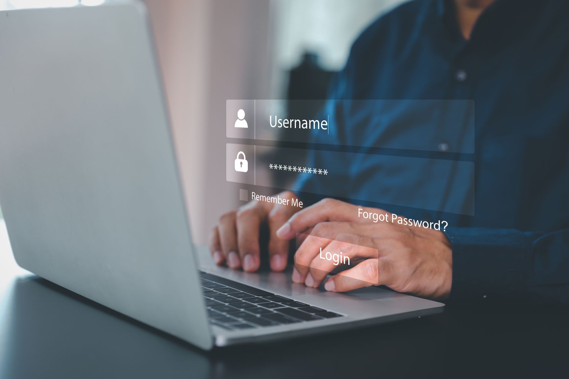 A person typing on a laptop with a digital login interface featuring username and password fields floating above it.