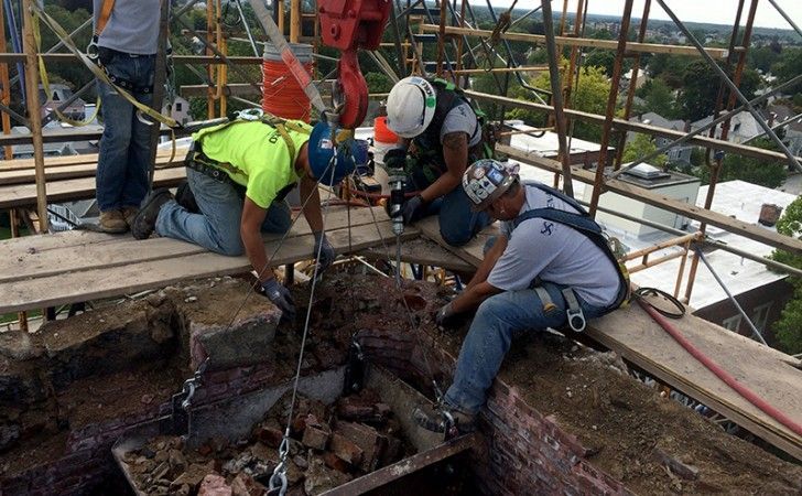 Crane-assisted removal of damaged steeple materials at Grace Episcopal Church — Cenaxo steeple reconstruction, New Bedford MA