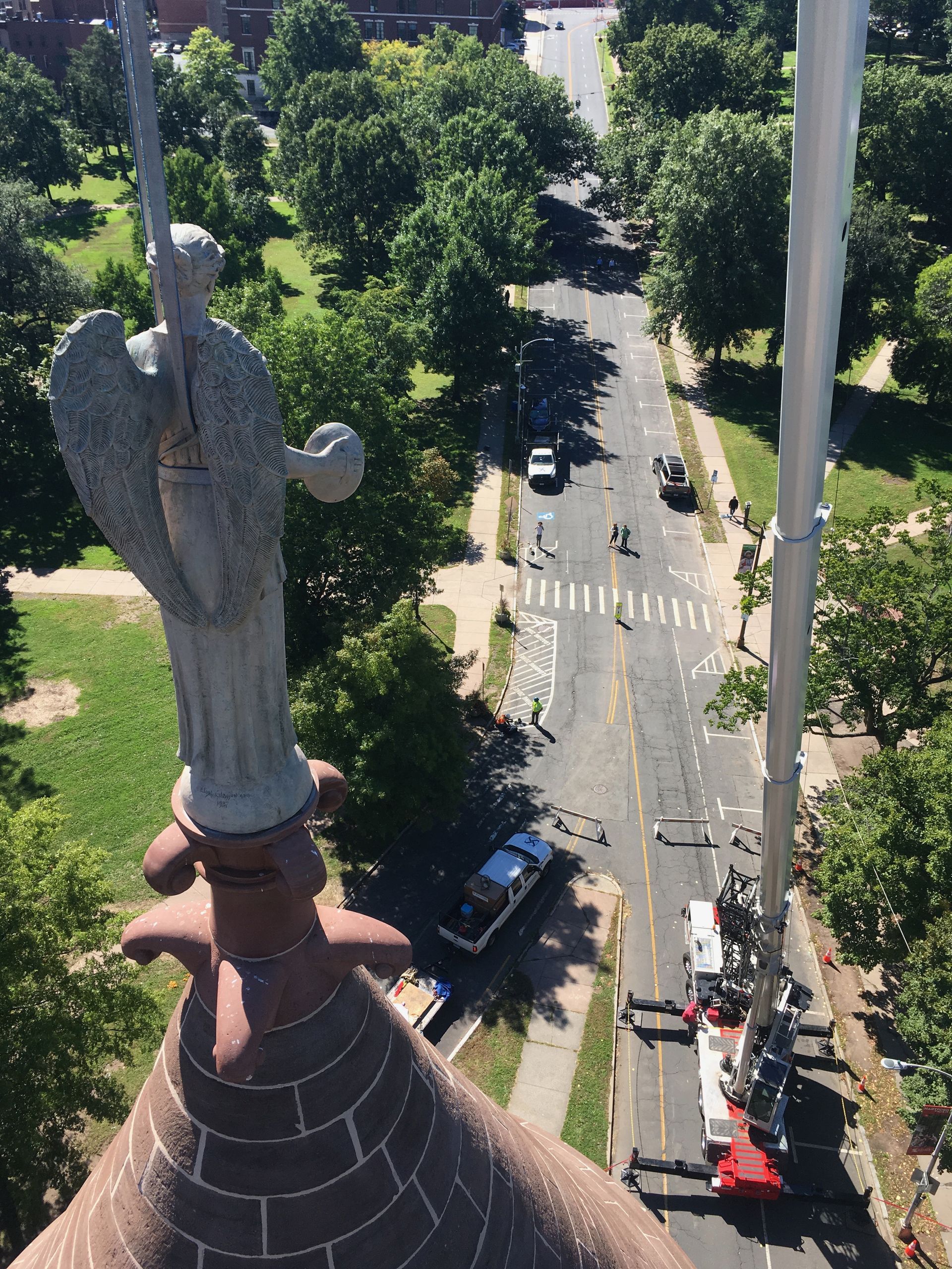 Cenaxo crane-assisted restoration of a stone angel atop a historic church spire — architectural restoration project in New England