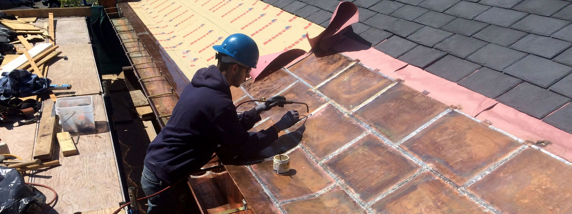 Cenaxo craftspeople performing historic slate roof restoration on a building in Hartford, CT