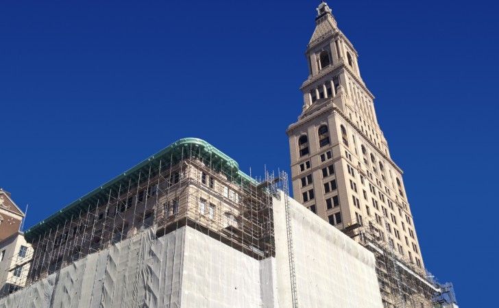 Travelers Tower during restoration — scaffolding, protective netting, and occupied-building coordination in downtown Hartford, CT by Cenaxo