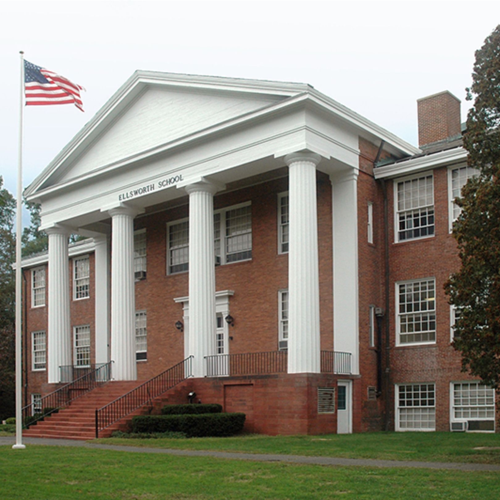 Historic school building restoration by Cenaxo — brick masonry and portico preservation, New England