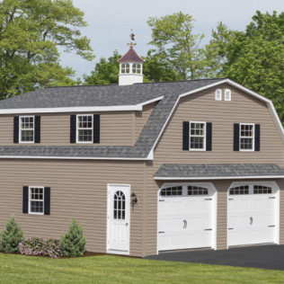 Two-story beige house with white garage doors, black shutters, and a small cupola surrounded by trees