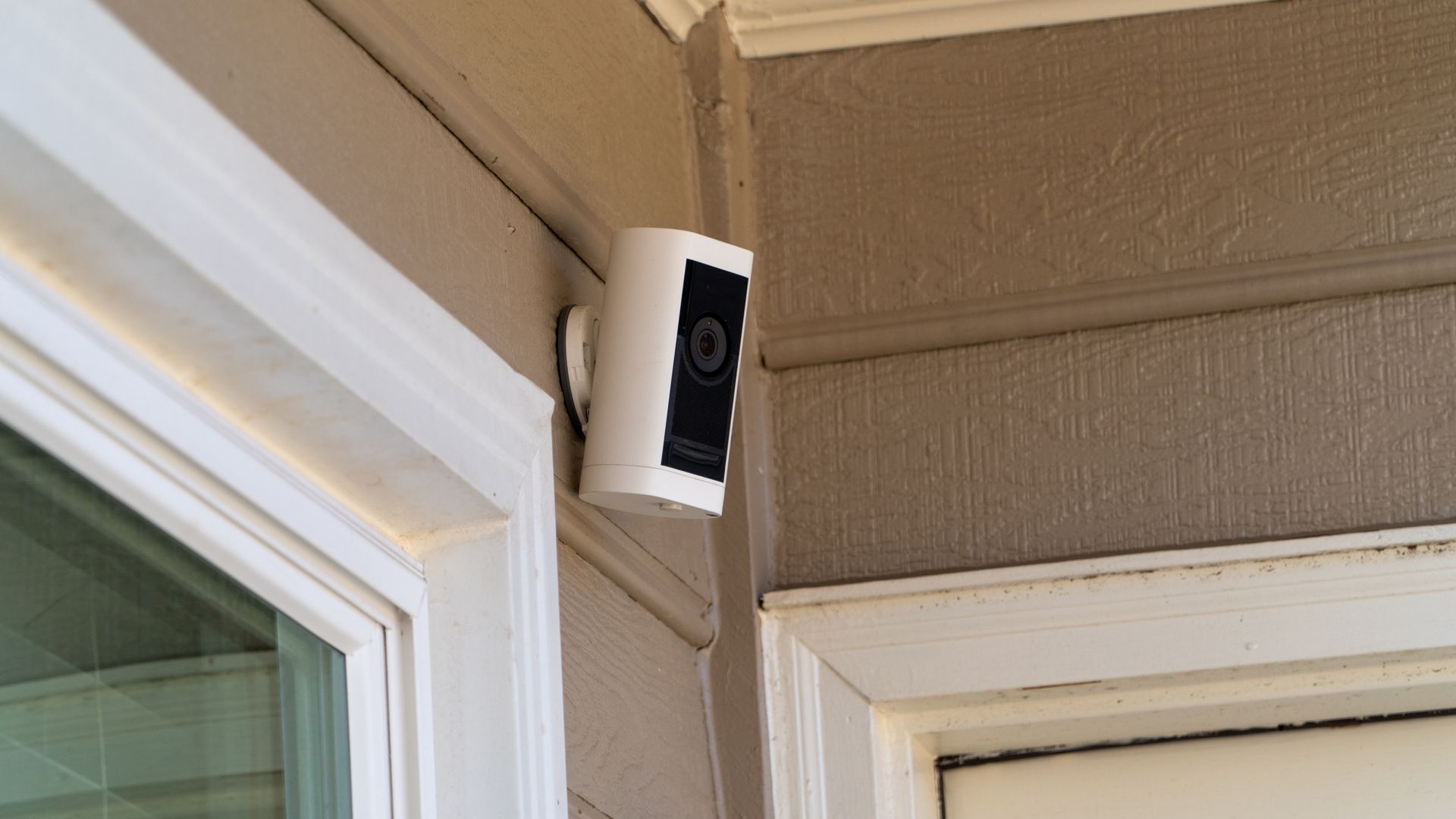 Outdoor security camera mounted on a home exterior by a residential security system installer. Outdoor security camera mounted on a home exterior by a residential security system installer.