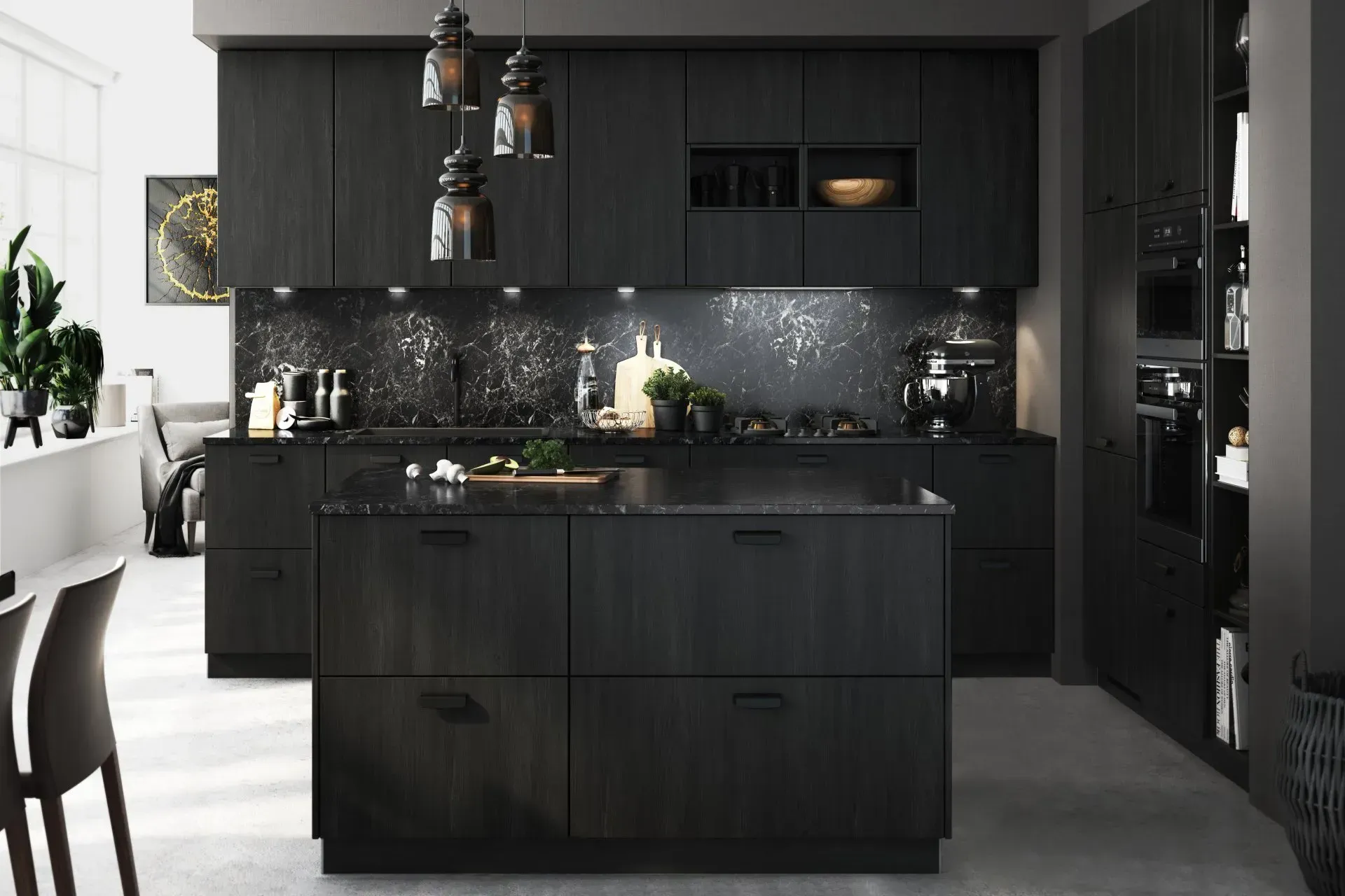 A kitchen with black cabinets and a large island in the middle.