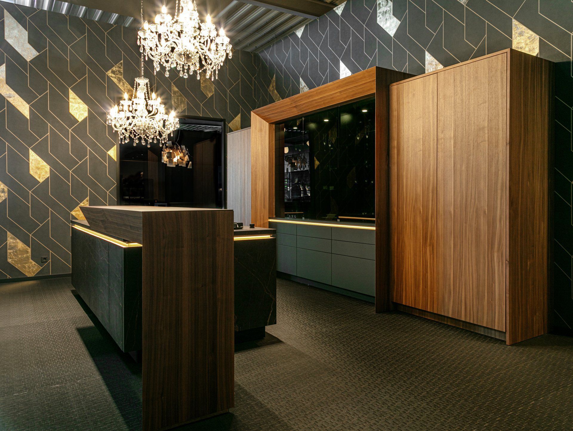 A kitchen with wooden cabinets and a chandelier hanging from the ceiling