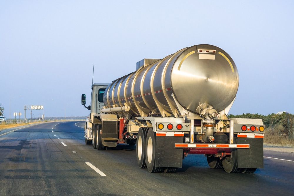 Tanker Truck Driving on A Highway, Silver Tank — Haigh Truck & 4WD Repairs In Orange, NSW