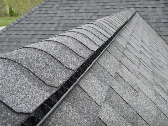 A close up of a roof with shingles.