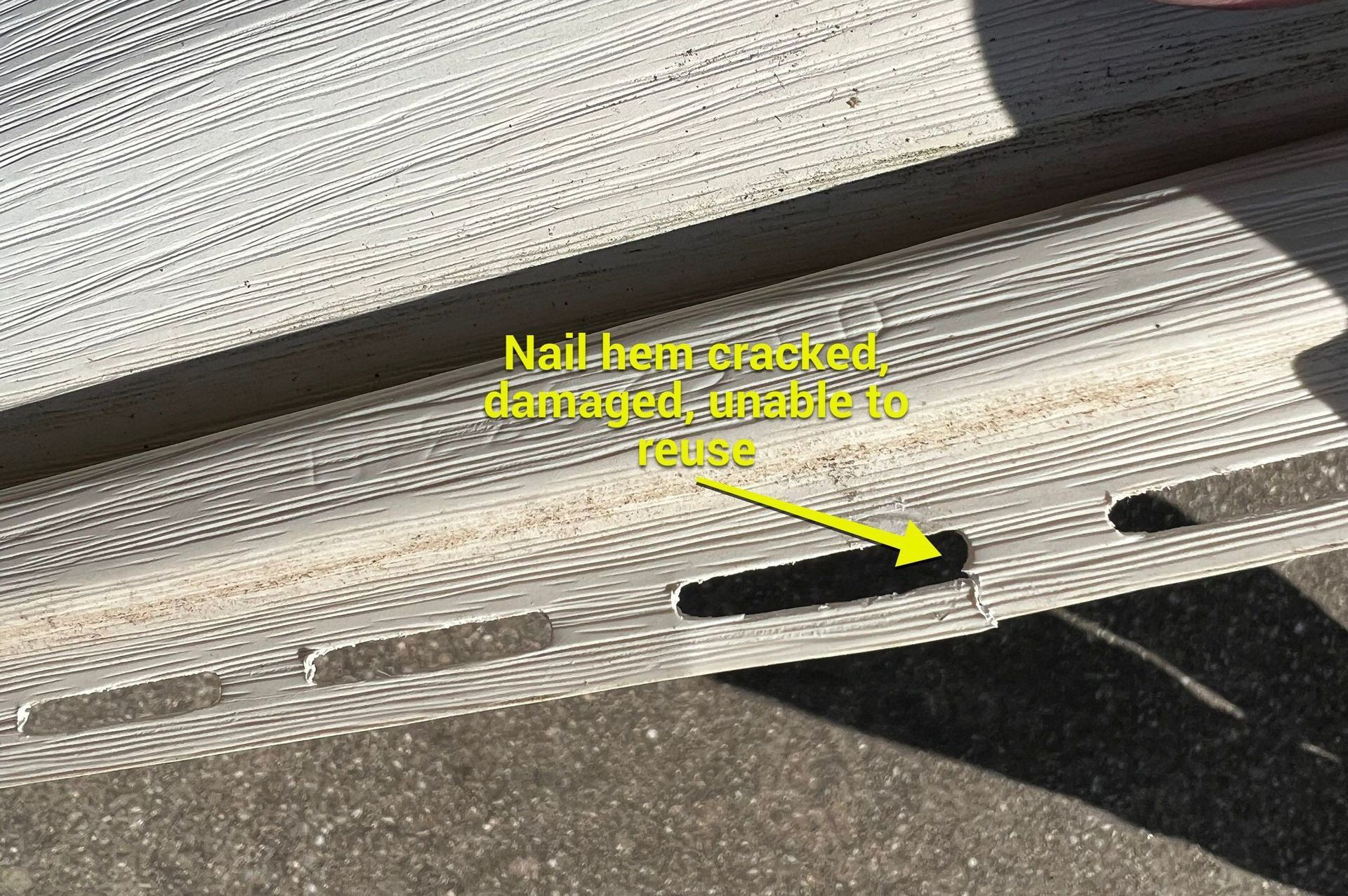 Vinyl siding repair in northern Kentucky. Damaged nail hem.