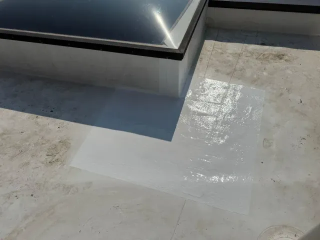 Silicone coating applied over a flat roof leak area, Mt. Adams, Cincinnati