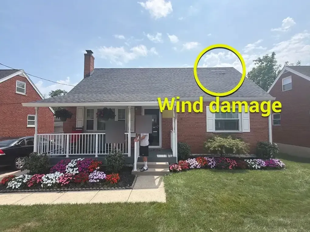 Wind-damaged asphalt shingle roof on a White Oak, Cincinnati home before insurance replacement