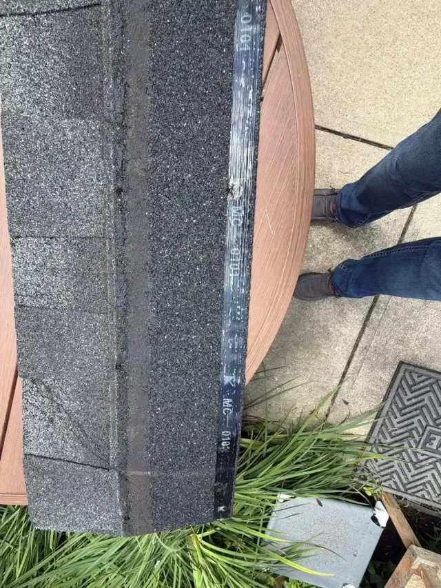 Wind-creased asphalt shingle found during a White Oak, Cincinnati roof inspection