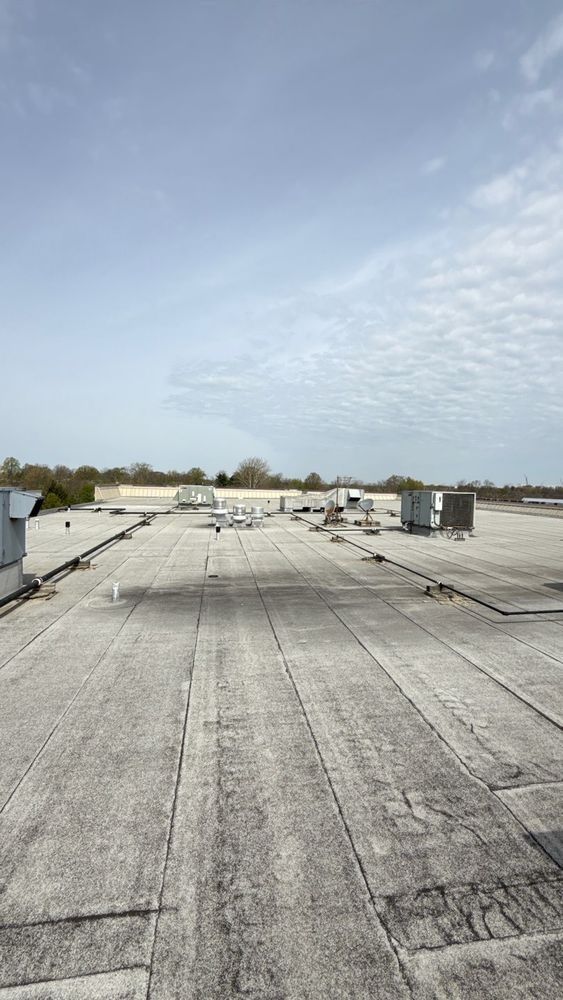 Commercial granulated modified bitumen flat roof with rooftop HVAC units in Florence, KY
