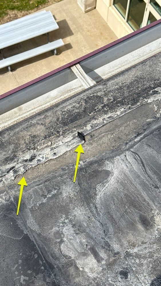 EPDM section separating from a modified bitumen flat roof at an incompatible taped seam