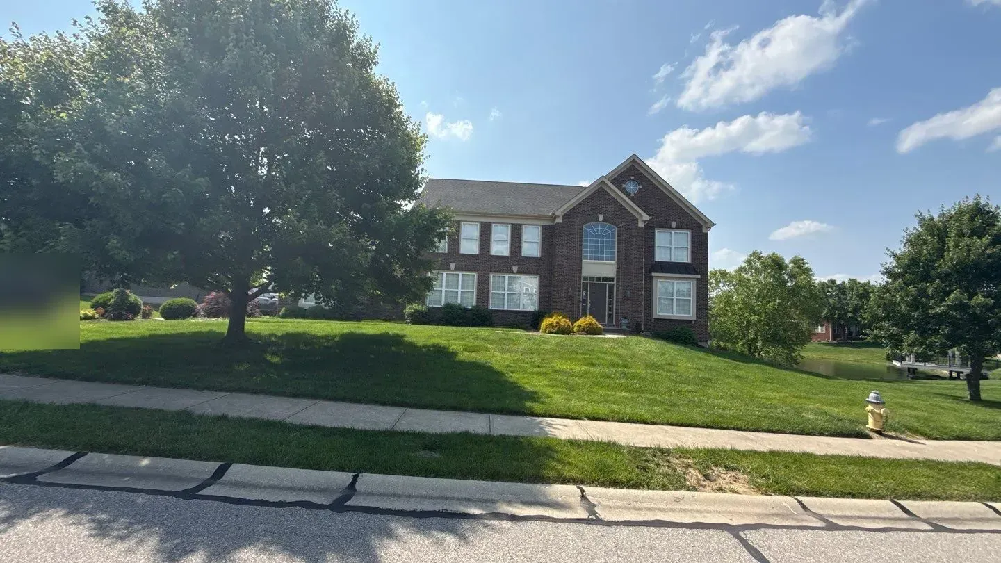 Two-story brick home in Florence, KY before its roof replacement