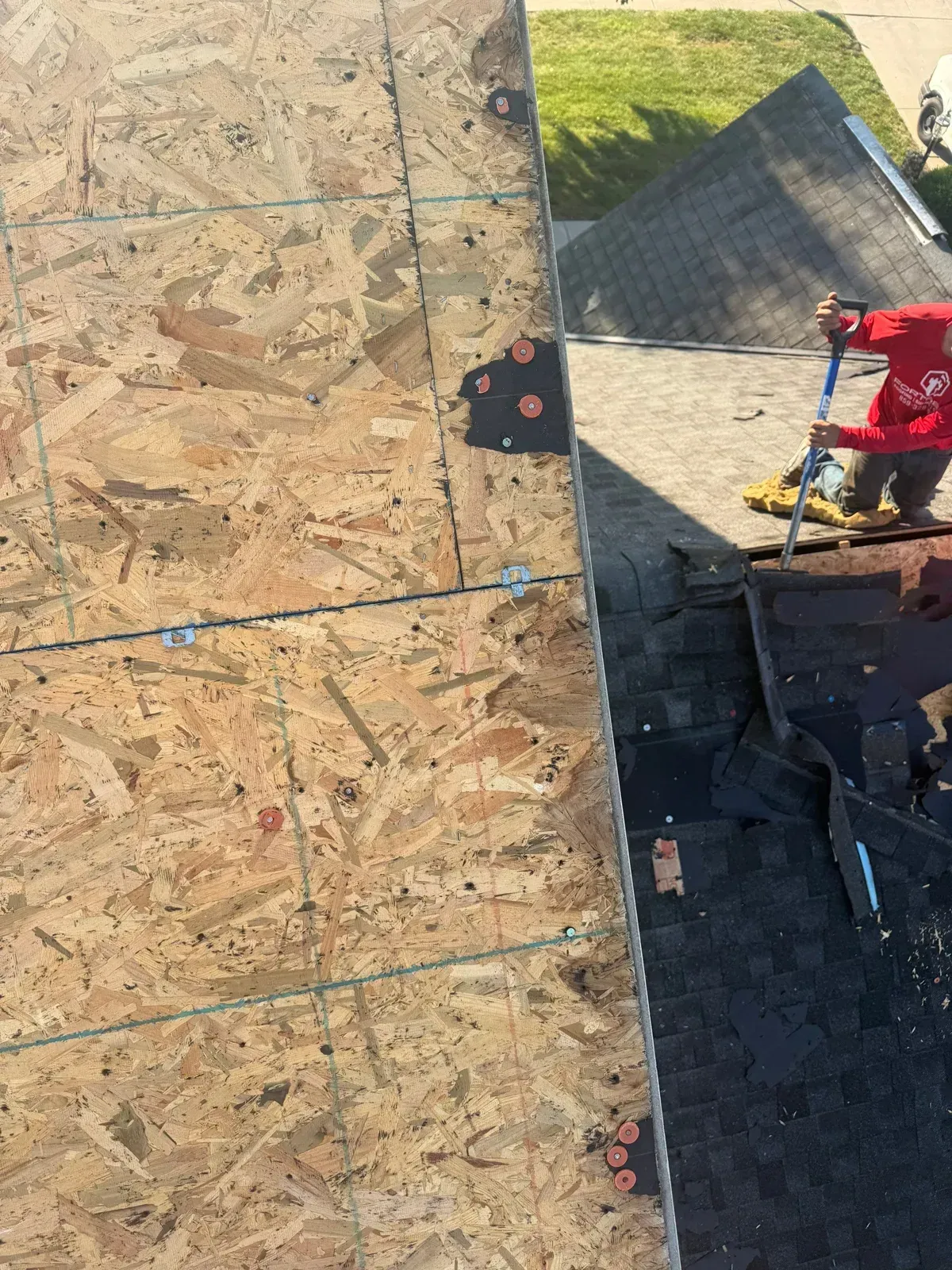 Exposed OSB roof decking after tear-off
