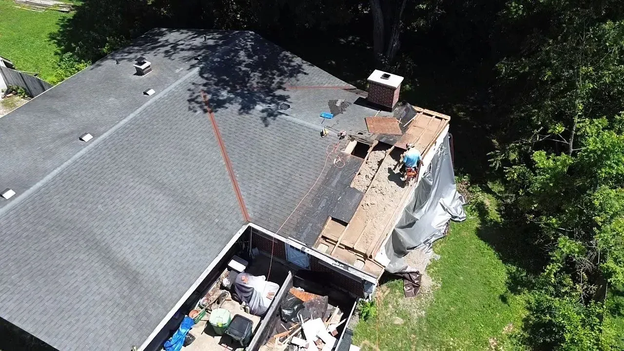 Drone view of roof replacement progress on a tree-damaged Florence, KY home