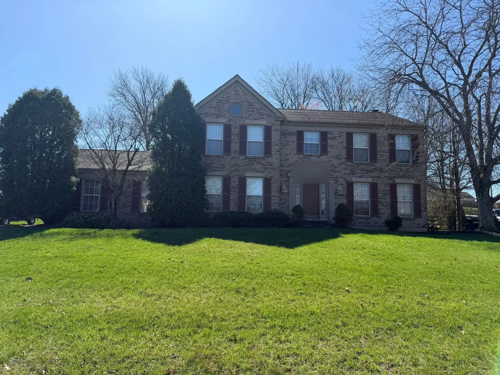 Two-story brick colonial in Florence, KY before its wind damage roof replacement