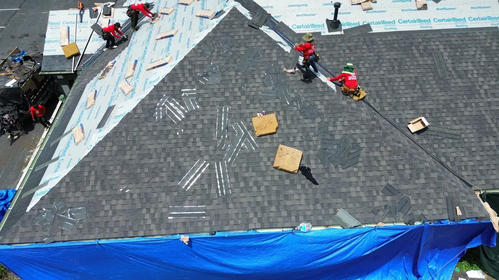 Crew installing Landmark PRO Espresso shingles on a Florence, KY office building