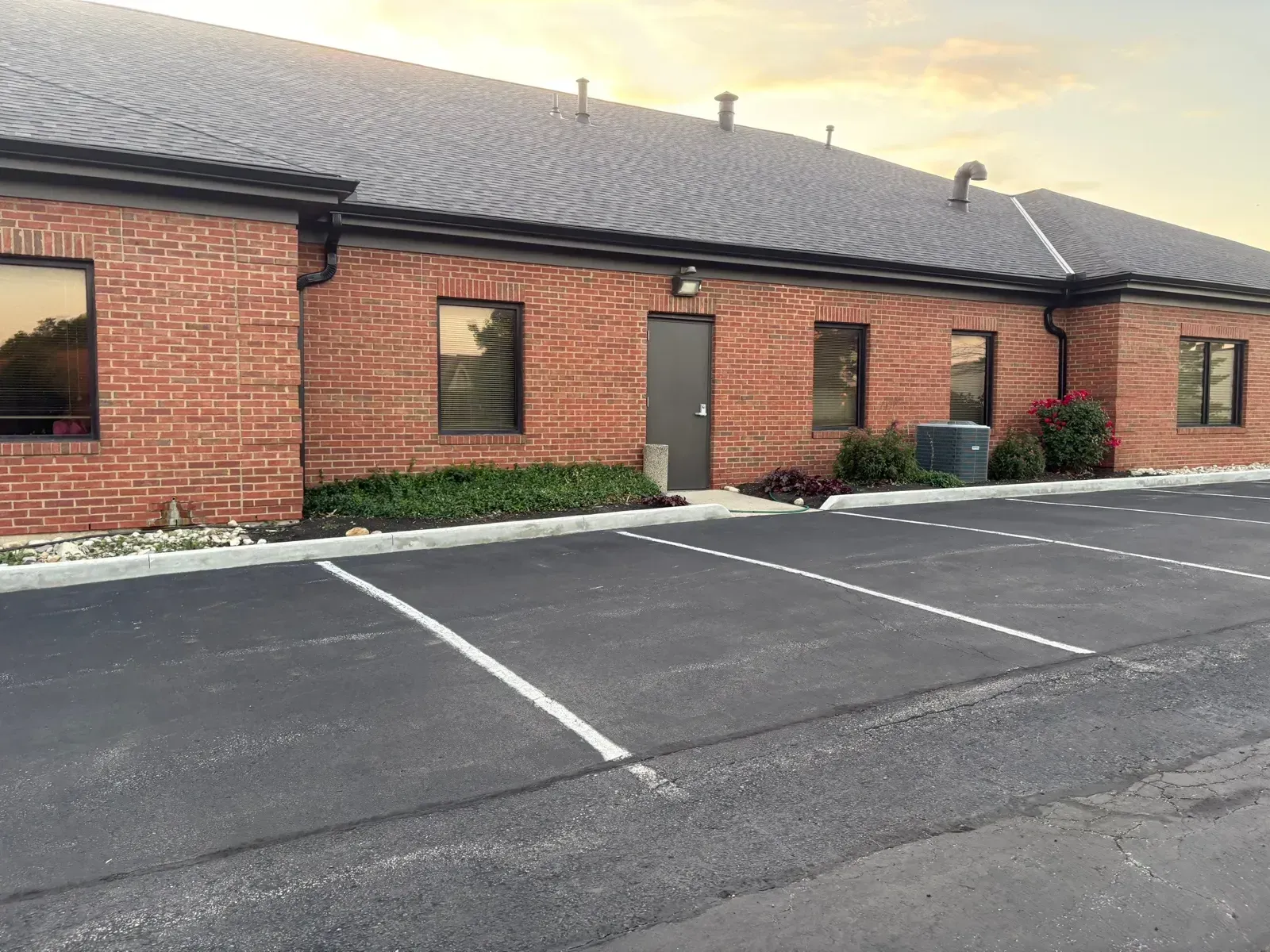 Finished Espresso shingle roof over the brick walls of a Florence, KY office building