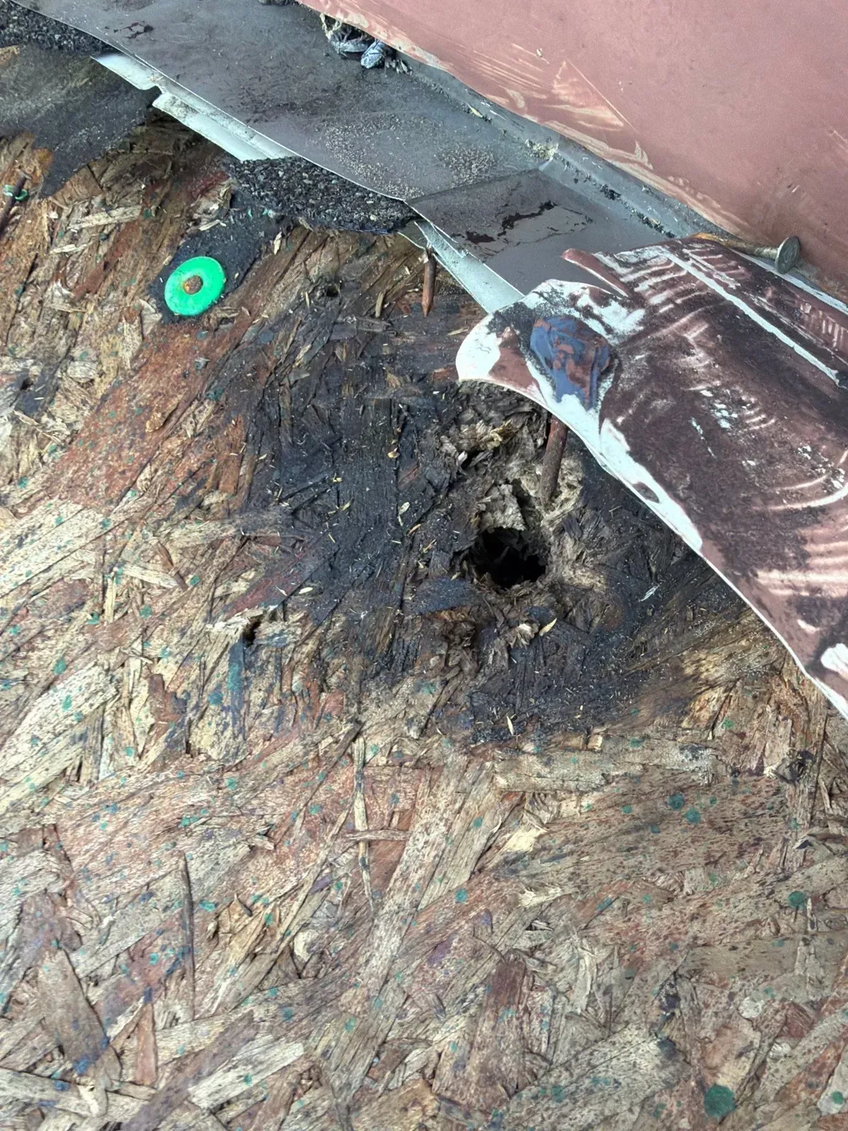 Rotted OSB roof sheathing at a valley with no ice and water shield, Florence, KY