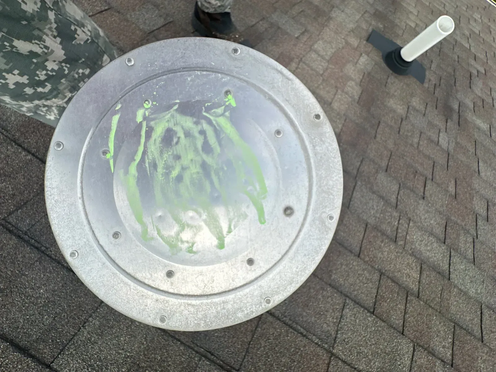 Hail hits marked in green chalk on a roof vent, Florence, KY