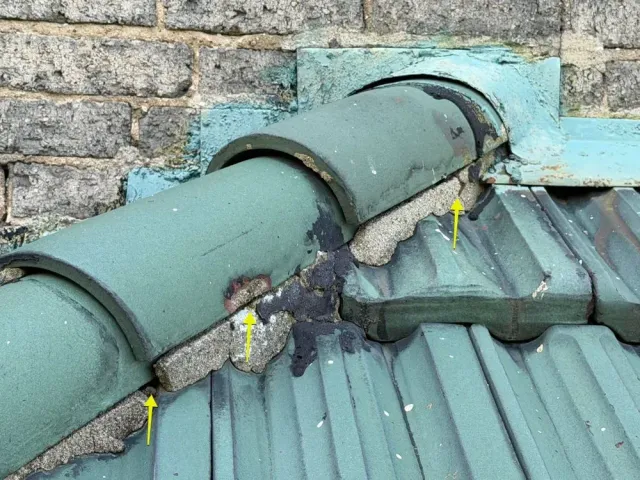 Mortar-set clay ridge tile checked during a Paddock Hills, Cincinnati roof assessment