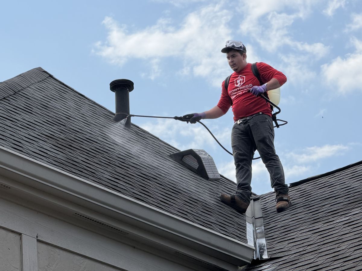 Low-pressure rinse of shingles near a roof vent