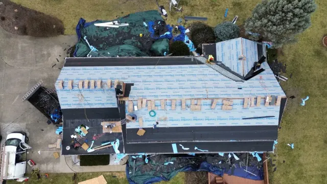 Drone view of roof tear-off in progress on a Pleasant Run, Cincinnati home