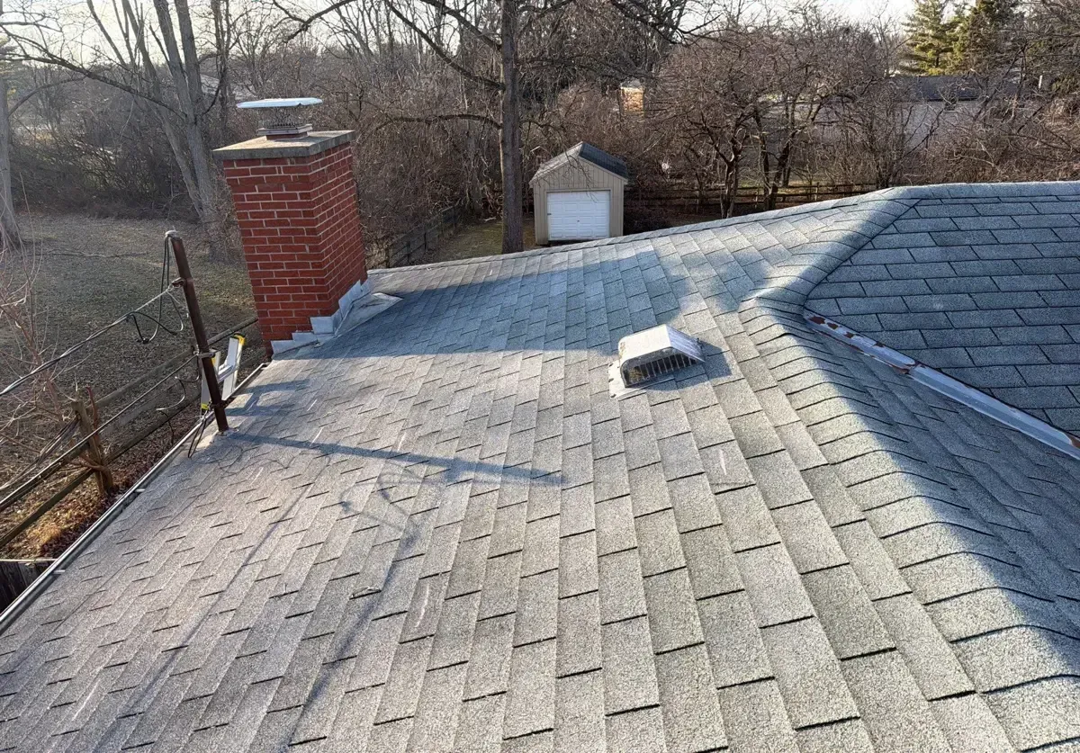 Original wind-damaged roof before replacement in West Chester