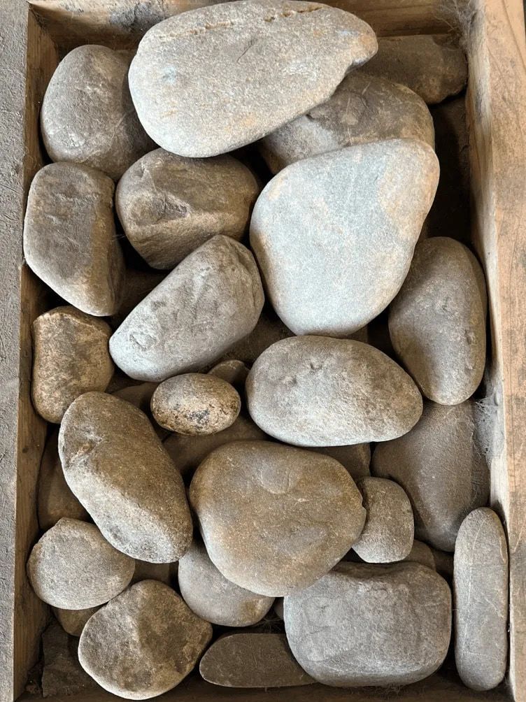 Smooth, Grey River Rocks Fill a Rectangular Container — The Soil Yard in Delacombe, VIC