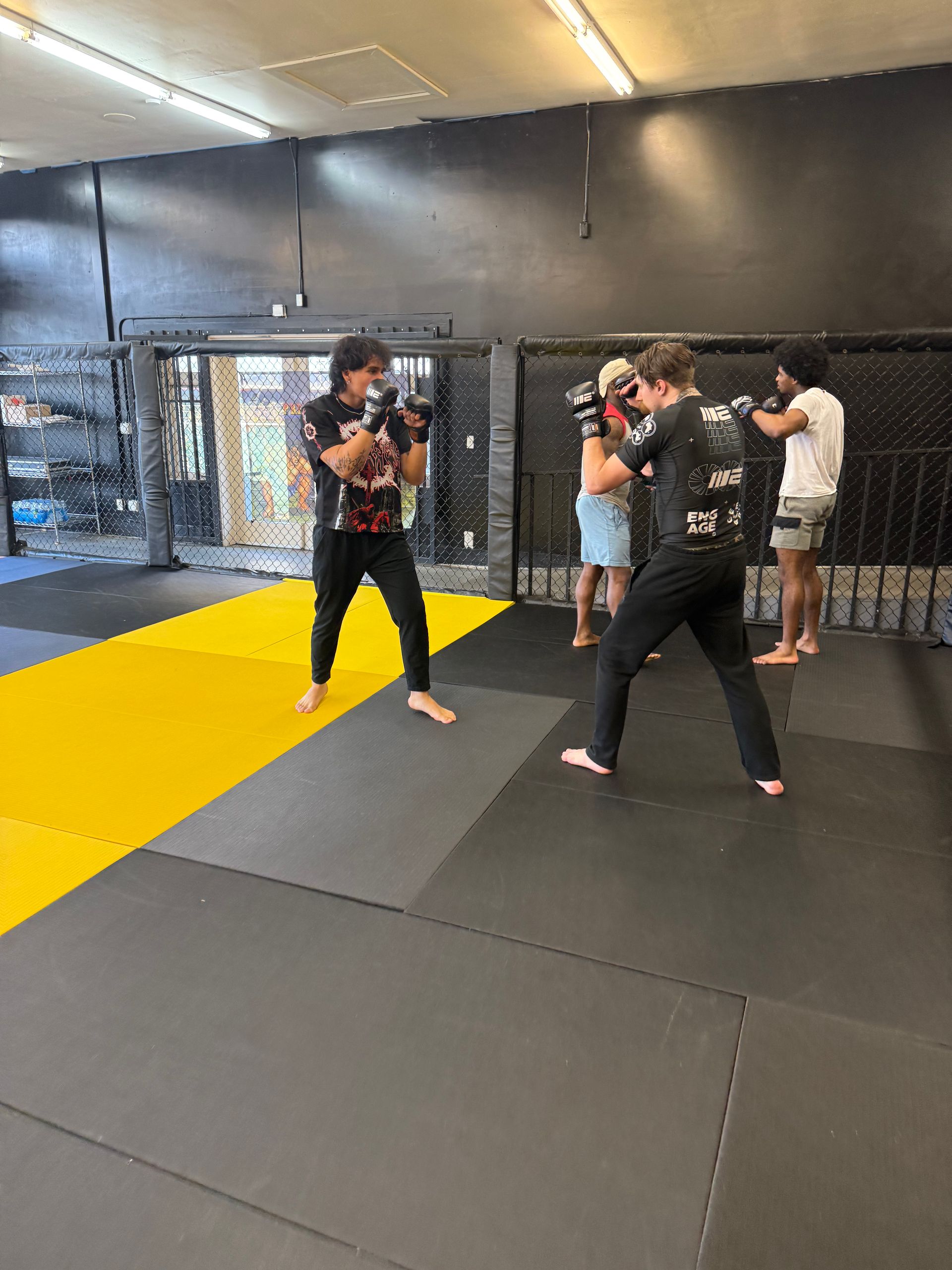 Adult Jiu-Jitsu students drilling grappling technique at Mythic Martial Arts in Tacoma, WA.