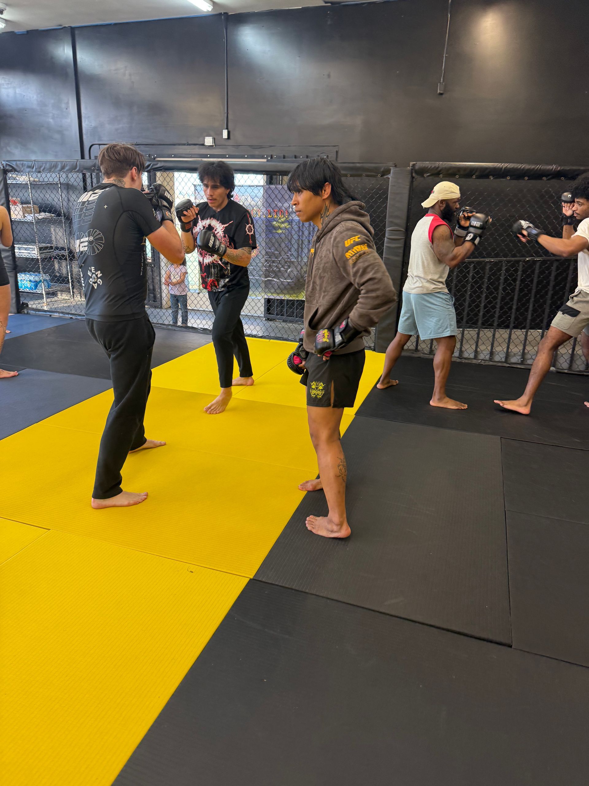 Adult students drilling Jiu-Jitsu techniques at Mythic Martial Arts in Tacoma, WA, building fitness.
