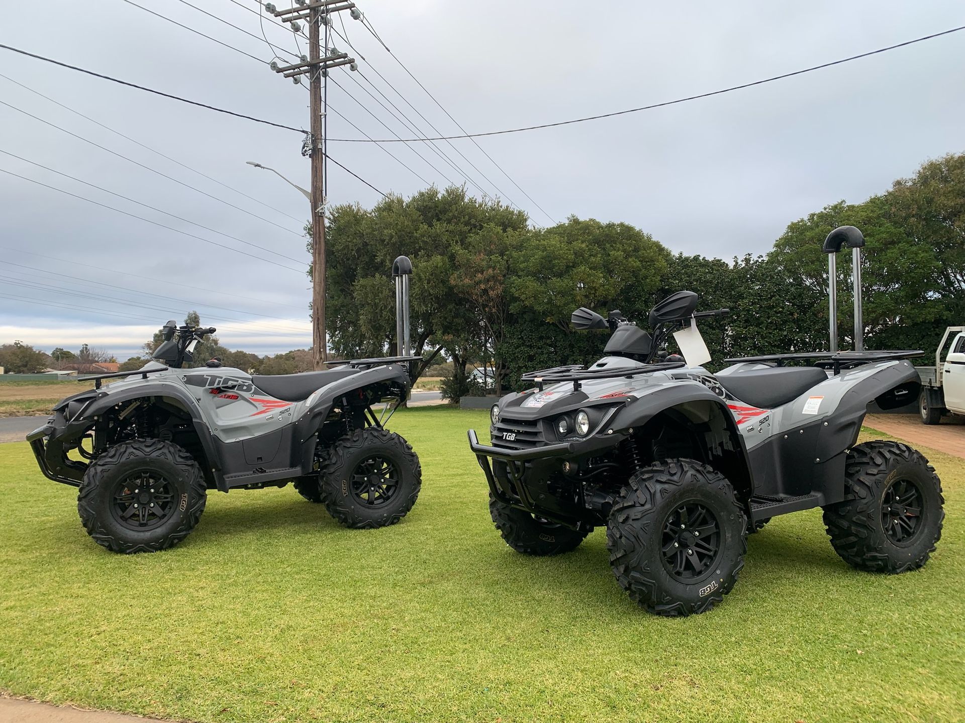 Gray ATV Parked Outside, With Black Tires and Red Accents — M.M & Mechanical in Dubbo, NSW