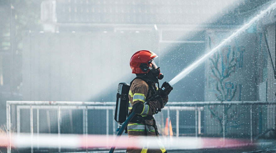firefighter putting out a homes for heroes house
