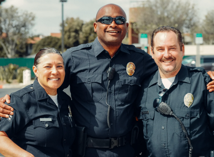 A group of police officers are posing for a picture together.