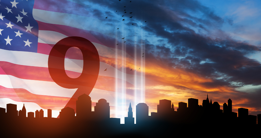 A silhouette of a city skyline with the number 9 in front of an american flag.