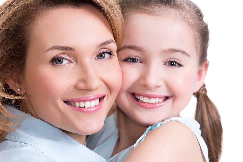 Mother And Daughter With Bright Smile — Dental Services in Gracemere, QLD