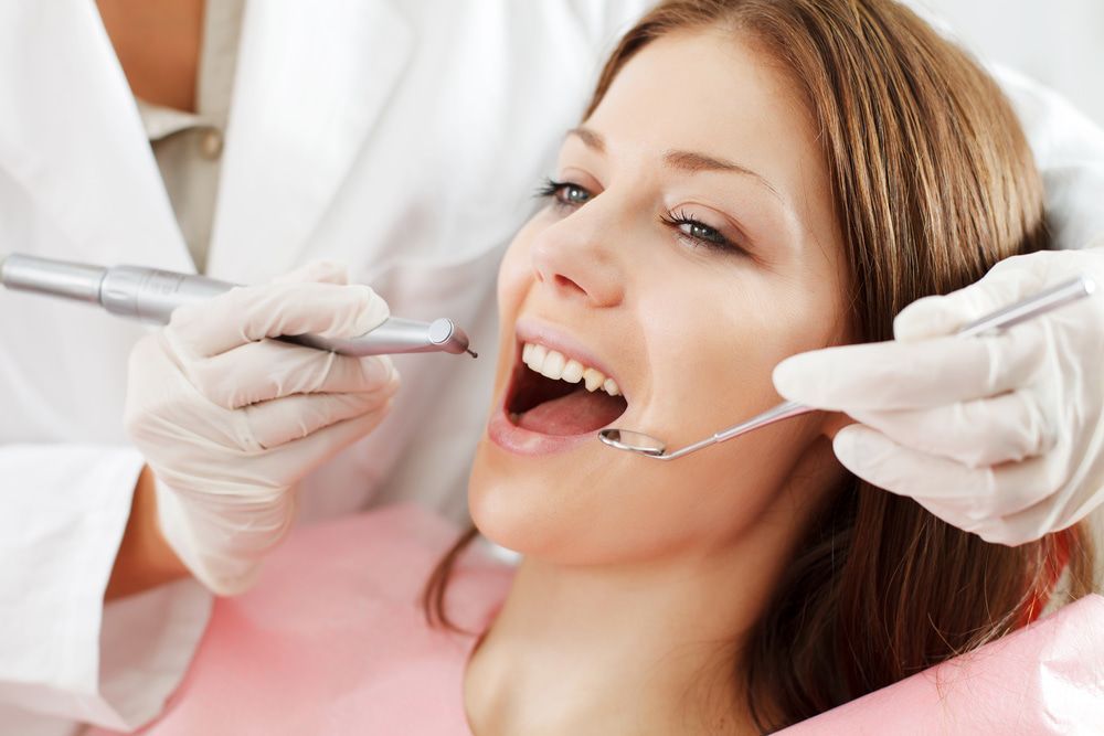 Woman Getting Dental Treatment — Dentists in Gracemere, QLD