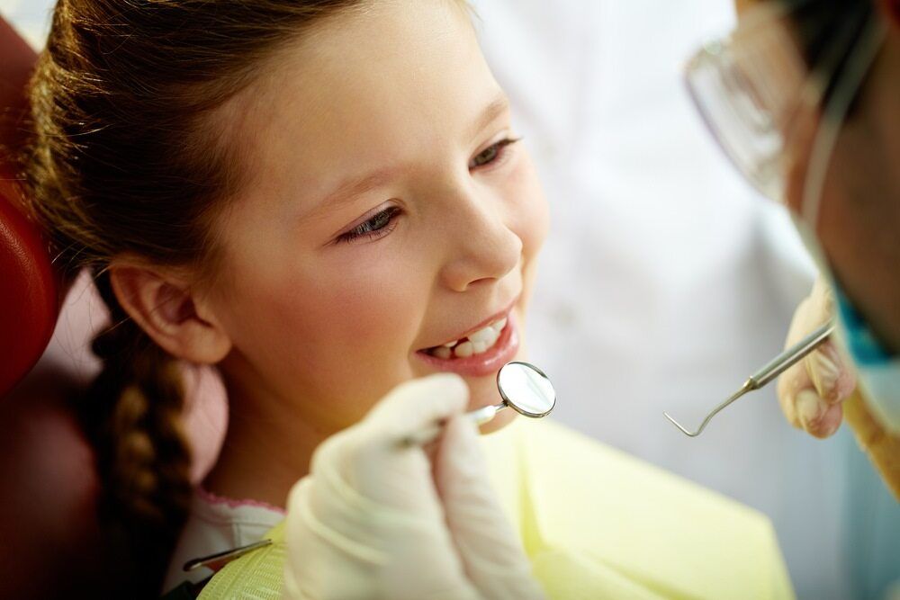 Girl Having Her Oral Check Up — Dentists in Gracemere, QLD
