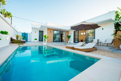 Yakuti villa private pool with sun loungers and umbrella