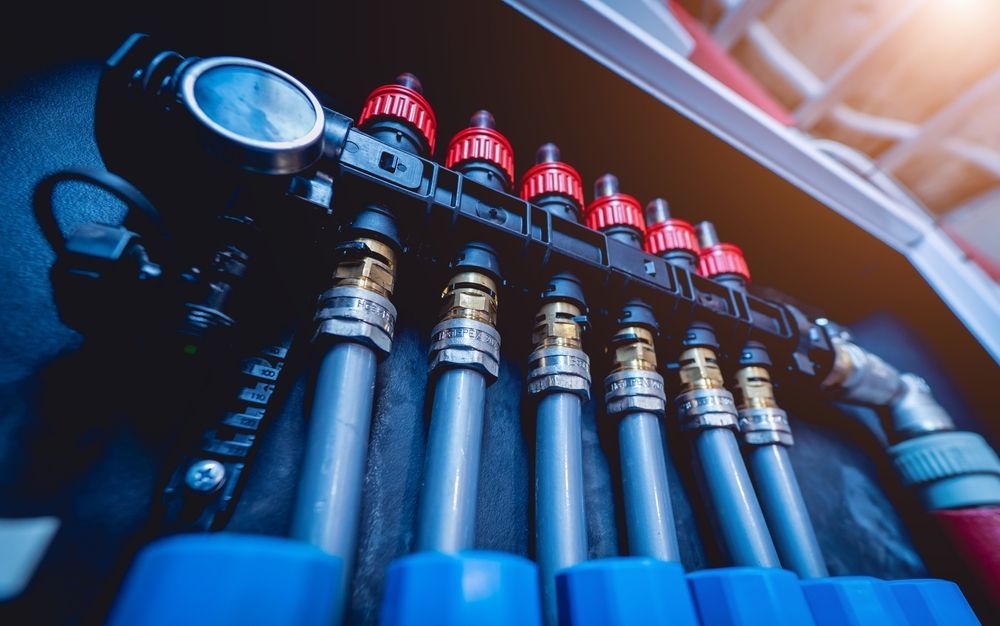A Close Up of a Bunch of Pipes in a Box — Mainline Plumbing & Civil Pty Ltd In Gilgandra, NSW