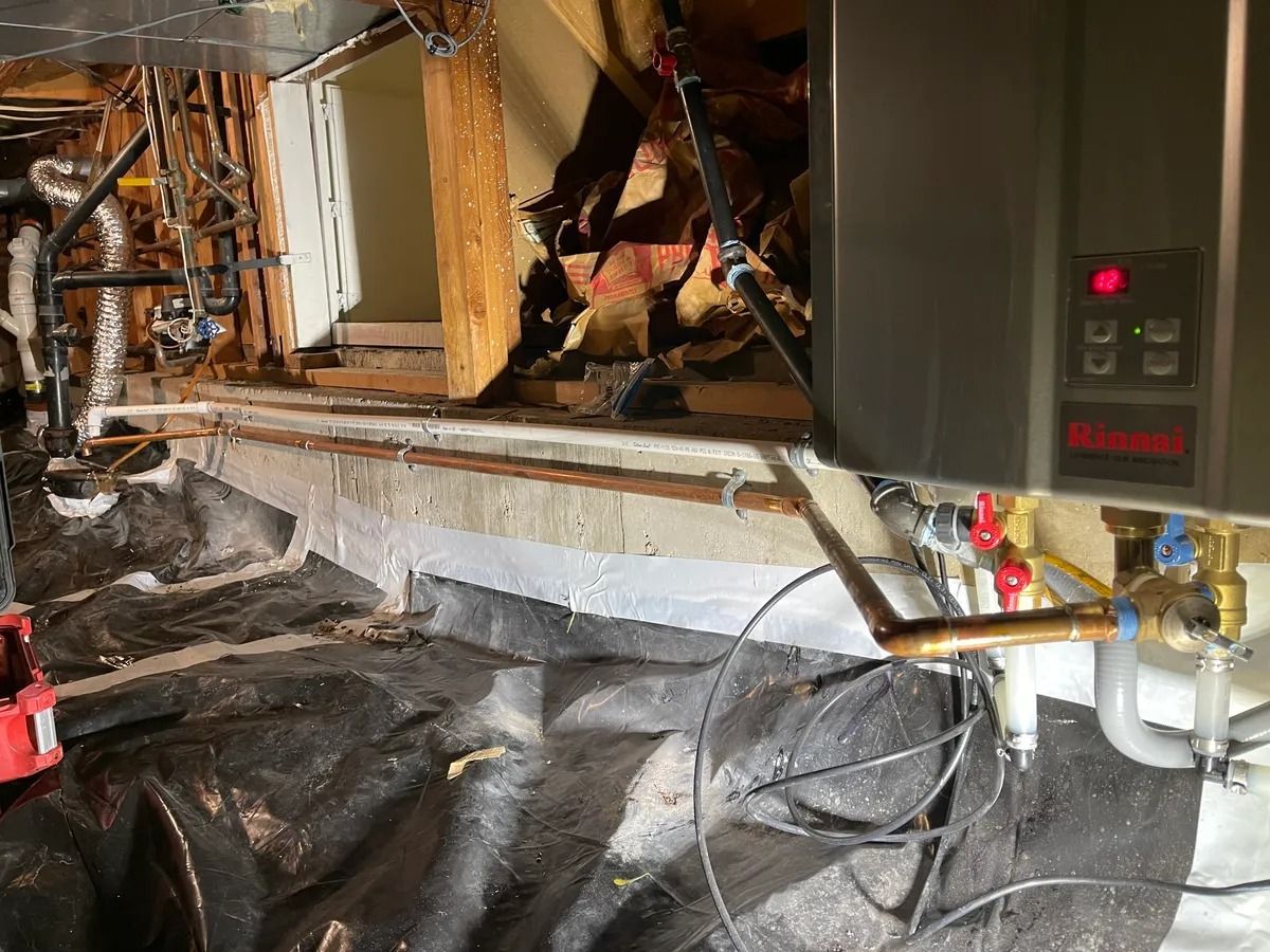 Damaged interior room with exposed wall framing, debris, and a heater or HVAC unit on the right