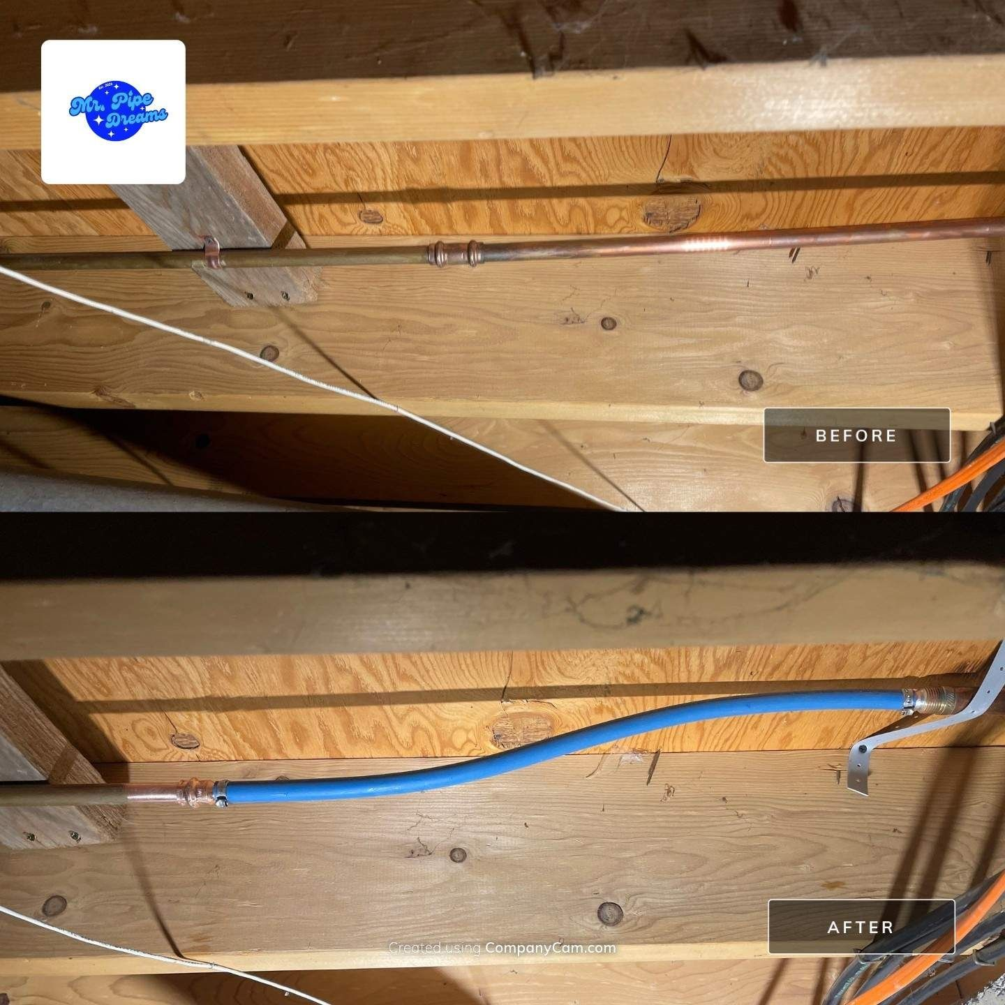 Wooden ceiling joists with a blue cable running across them and a black opening between beams