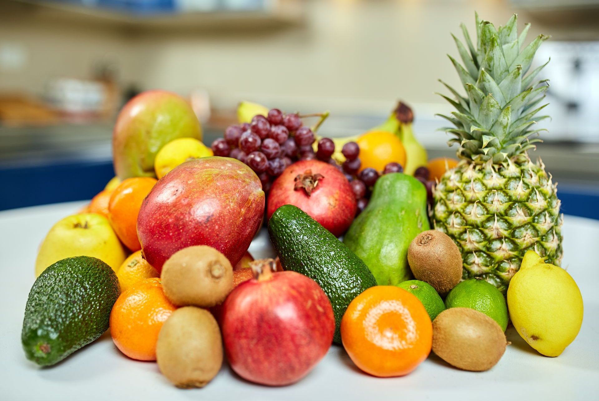 A white plate topped with a variety of fruits and vegetables.