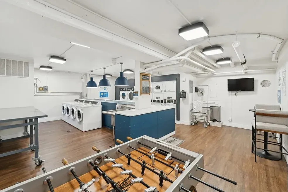 There is a foosball table in the middle of the room.