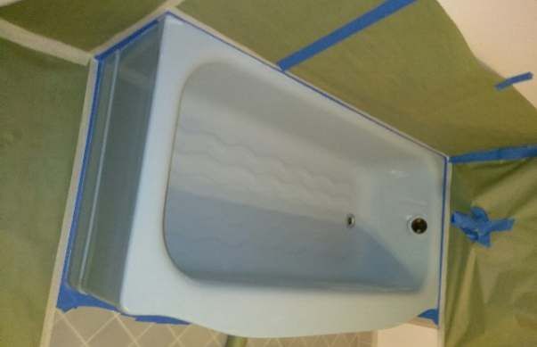 a bathroom counter with a sink and a box of tissues