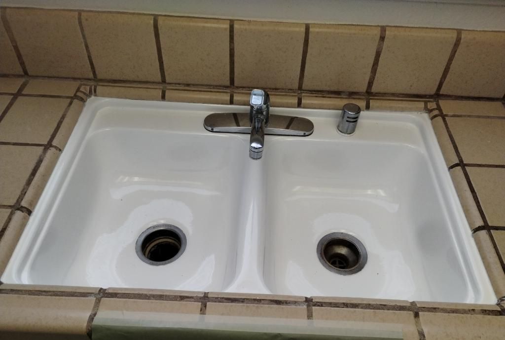 a bathtub with a shower attached to it