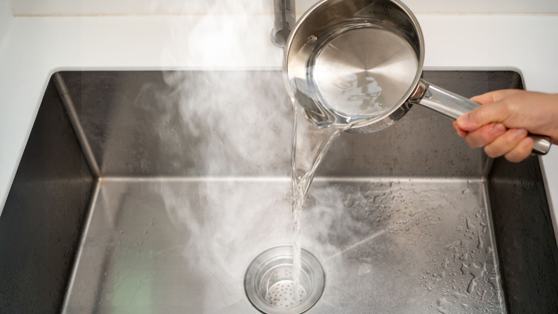 grease causing drain clog buildup in household pipes