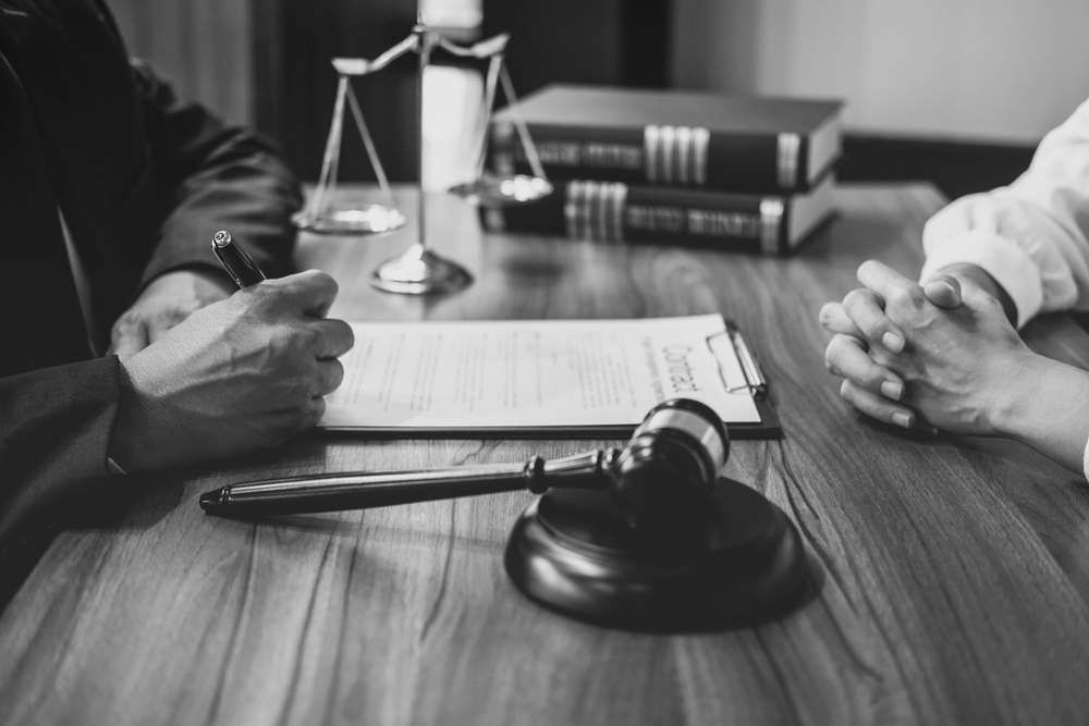 Criminal Lawyer In Robina Discussing Case With Client